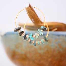Turquoise drop earrings with natural stone accents, featuring a bohemian, nature-inspired design.