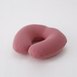  A soft, pink neck pillow designed for comfort and relaxation.