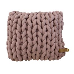 Oversized mauve knit cushion made of thick cotton yarn, with a coarse, chunky texture and a plump, rectangular shape.