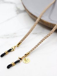  Beige cord necklace with gold-tone accents and charms. Available in multiple color variants including beige, black, brown, and dark blue.