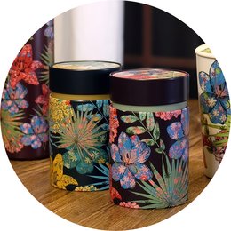 Rustic metal storage box with vibrant floral pattern, suitable for storing small items. Dimensions: 150g.