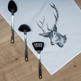 A white tea towel with a dark gray deer illustration. The towel features a simple, minimalist design with the deer silhouette as the focal point.