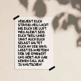 A poster with a handwritten text in German that expresses a message about love and relationships.