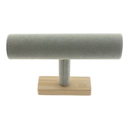  A gray T-shaped jewelry stand with a wooden base, suitable for displaying and organizing jewelry.