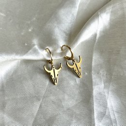 Gold-toned bull-shaped hoop earring made of metal.