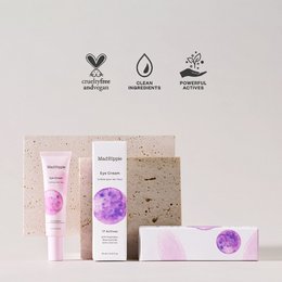  A pink and purple eye cream in a tube, designed to nourish and hydrate the delicate eye area. Contains peptides and hyaluronic acid to reduce the appearance of fine lines and wrinkles.