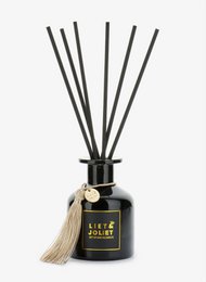Fragrance sticks in a sleek black bottle with a tassel accent, offering a refreshing ocean breeze scent. Ideal for home fragrance diffusion.