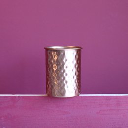 Sonali Copper Timable - Mate, a hammered copper tumbler with a textured surface, suitable for serving hot or cold beverages.