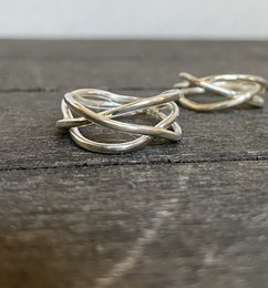  Silver tangle small ring, a statement ring with an intricate, intertwined design in a silver tone.