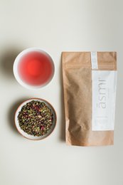 Purify Tea - Eco Paper Bag. A blend of organic green tea, lemongrass, and ginger in an eco-friendly paper bag.