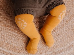 Orange baby crawling tights with animal print design, suitable for 6-12 month and 12-18 month sizes.