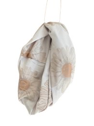  Soft, floral-patterned headband or scarf in neutral tones, suitable for children.