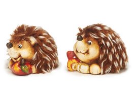 Decorative hedgehog figurine, approximately 6x5x5cm in size, made with soft fur material. The hedgehog is holding an apple in its paws.