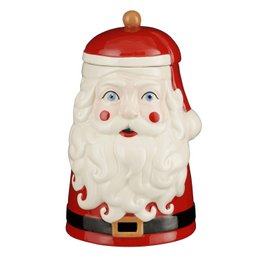  A round, tall ceramic storage jar with a red lid and a Santa Claus design. The jar has a white body with a Santa Claus face and beard, and a red lid with a wooden knob on top.