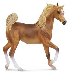 A large, tan-colored horse figurine with a flowing mane and tail, standing on a white background.