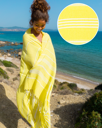 Yellow striped beach towel made of soft, absorbent Turkish cotton. Ideal for the beach, pool, or sauna.