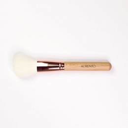 Soft, fluffy powder brush with wooden handle for applying makeup powder evenly.