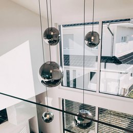 Spherical glass ball pendant light with chrome, gold, and black color options in various sizes from 20cm to 50cm diameter. Suitable for wall lighting in modern and minimalist interior design.