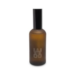 A 100ml room spray in the Treasure or Tranquility scent, with a brown glass bottle and a minimalist design.