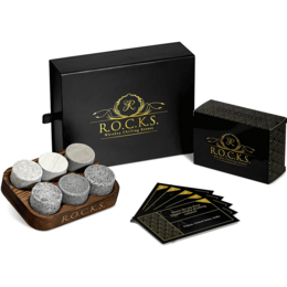 The Rocks x Whiskey Trivia Quiz Gift Set is a cocktail set that includes whiskey stones, a wooden tray, and trivia cards. The set features a sleek black and gold design, making it a stylish and functional gift for whiskey enthusiasts.