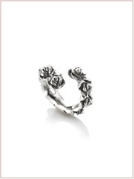  Burnished and gold stack rings with floral design, suitable for everyday wear.