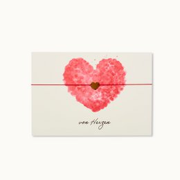  A heart-shaped card made of red carnation flowers, with the text "one heart" written on it. The card is designed for expressing love and affection.