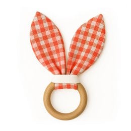 Gingham organic cotton teething ring with soft, textured ears for soothing baby's gums. Vibrant red and white checkered pattern. Wooden ring for safe, natural teething.