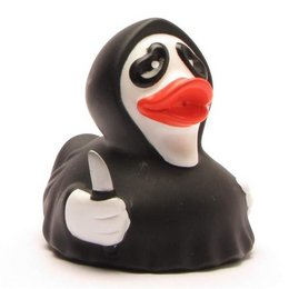 A black and white rubber duck bath toy with a large red beak and eyes.