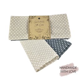  A set of 2 tea towels with a polka dot pattern in neutral colors of beige and gray. The towels are handmade with love and feature a simple, classic design suitable for everyday use in the kitchen.