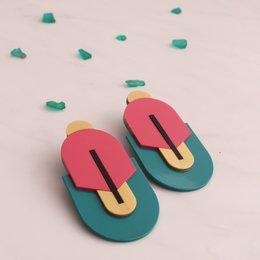 Vibrant statement earrings made of cellulose acetate in a bold color-blocked design with a modern, geometric shape.