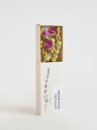 Rose blend mini tea in a wooden box with dried rose petals and lavender.