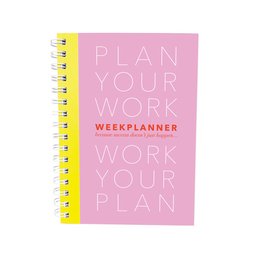 A pink spiral-bound planner with the text "Plan Your Work" and "Work Your Plan" printed on the cover. The planner has a weekly layout with sections for Monday through Sunday.