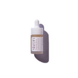  Travel-size moisturizing anti-aging face serum in a light purple bottle with a white dropper.