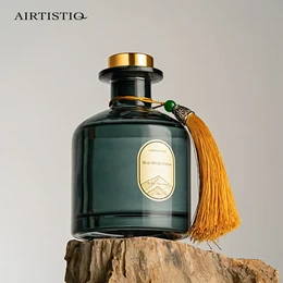 A 150ml reed diffuser with an aroma fiber stick. The diffuser has a dark green glass bottle with a gold cap and a decorative tassel.