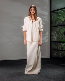  A long, flowing cotton-blend maxi skirt in a neutral off-white color, available in sizes 34 to 42.
