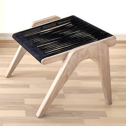 White oak stool with black cords, rectangular shape, modern minimalist design.