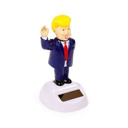 Yellow blonde hair, blue suit, red tie, waving hand gesture, solar powered bobblehead statue, political figure collectible.