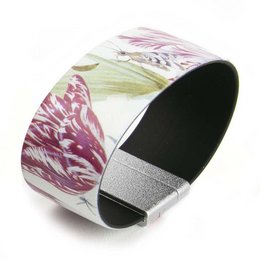 Floral cuff bracelet with pink and green chrysanthemum-like flowers on a white background. The bracelet has a black interior and is presented in a matching box.