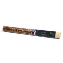 Organic fruit tea in a glass tube with a variety of dried fruit pieces visible through the glass.