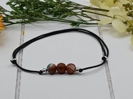 Bracciale con pietre preziose a flusso d'oro