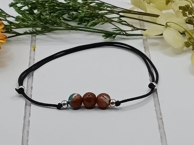 Bracciale con pietre preziose a flusso d'oro
