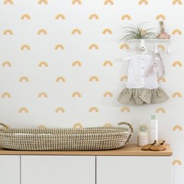 Colorful rainbow-shaped wall stickers in various sizes and colors, including yellow, blue, pink, brown, and green. The stickers can be used to decorate a nursery or child's room.