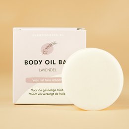 Lavender-scented body oil bar with a solid, round shape. Made with natural ingredients to moisturize and nourish the skin.
