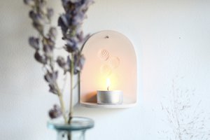 Wandhanger van keramiek met kaarsje