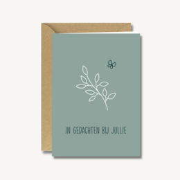 A sympathy card with a simple floral design and the text "In Gedanken bei Julie" (Thinking of you, Julie) in a muted green color.