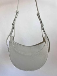 Yara shoulder bag, crescent moon shape, soft leather, adjustable straps, available in beige, rose, black, taupe, light blue, citron, light green.