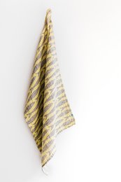 A striped, yellow and white tea towel with a textured pattern. The towel appears to be made of a soft, absorbent material and would be suitable for drying dishes or hands in a kitchen.