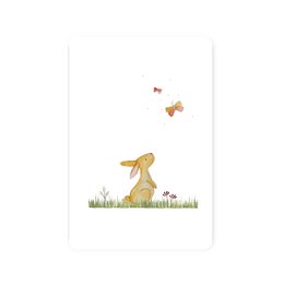 A postcard featuring a watercolor illustration of a bunny and butterflies in a grassy field.