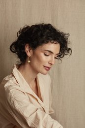 Small gold-tone drop earrings with ginkgo leaf-inspired design and short chain loops.