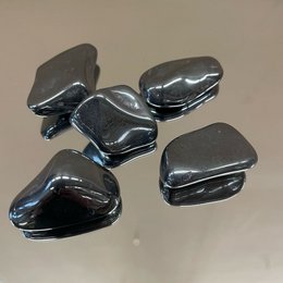  Hematite stones, dark gray in color, irregular in shape, with a shiny, metallic appearance. Suitable for use in jewelry, decoration, or as a natural healing crystal.